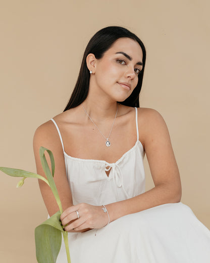 Pulsera con la Virgen de la  Medalla Milagrosa y Cruz